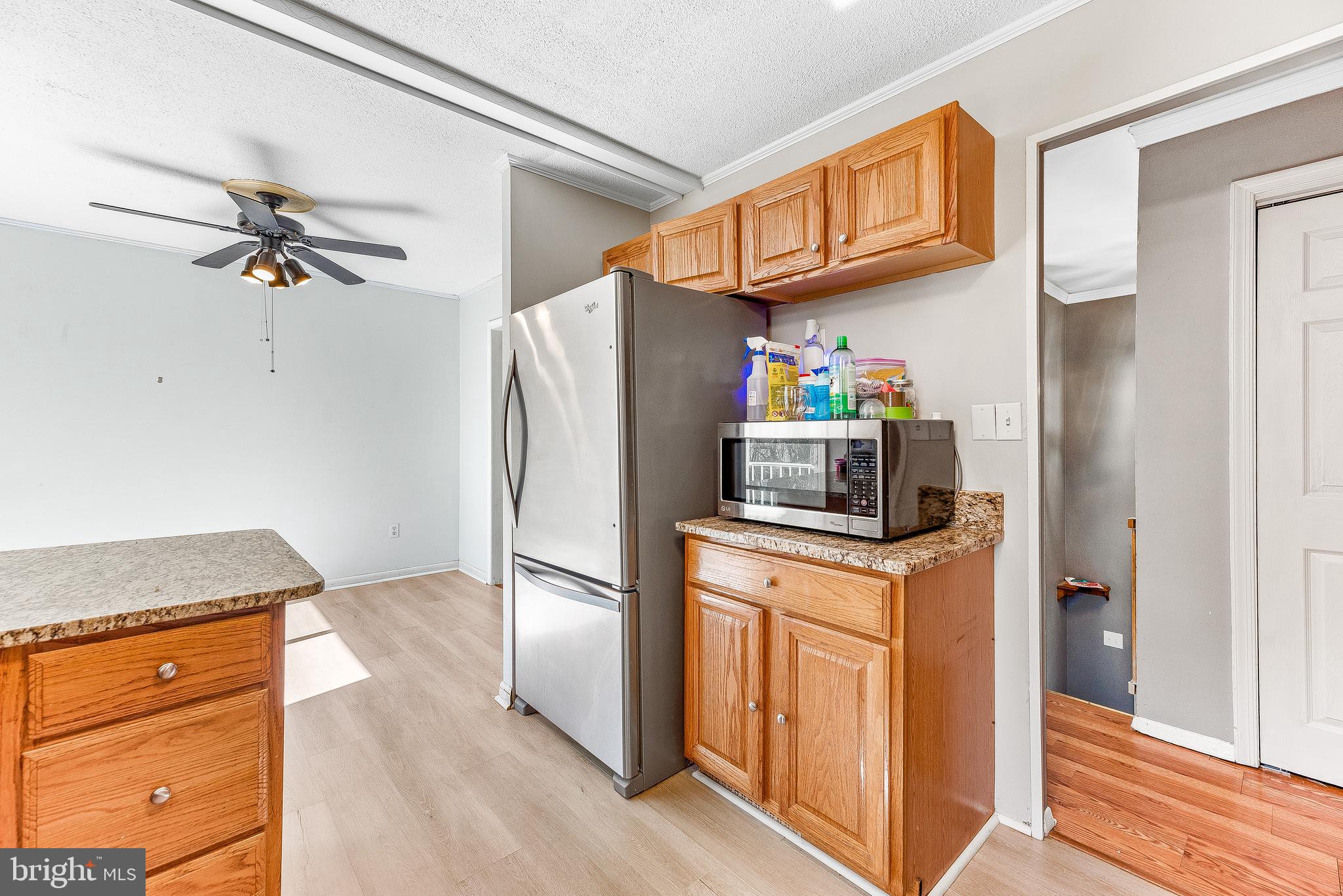 11951 Prince Court Dunkirk, MD 20754 - Photo 56 of 72 a kitchen with stainless steel appliances granite countertop a refrigerator a stove and a sink with cabinets