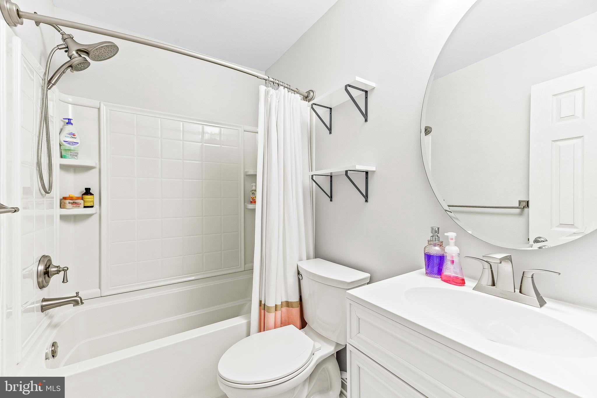 11951 Prince Court Dunkirk, MD 20754 - Photo 62 of 72 a white toilet sitting next to a bath tub and a shower