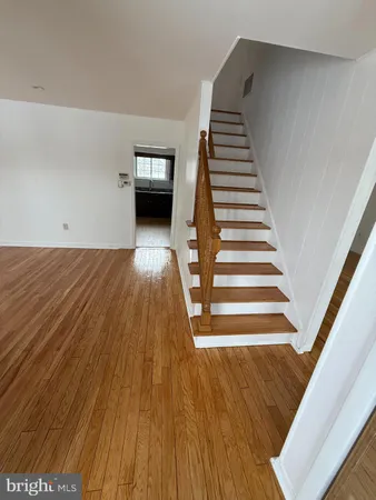 a view of kitchen with wooden floor