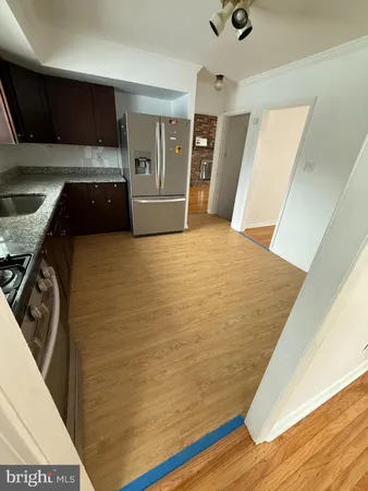 a view of empty room with window and stairs
