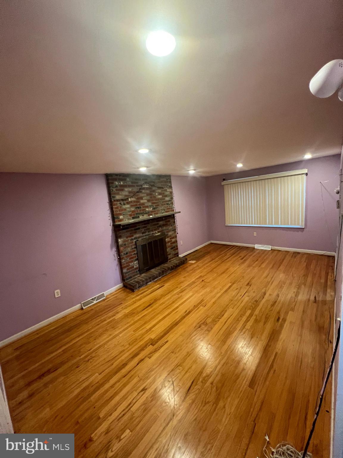 2561 Burning Tree Road Pennsauken, NJ 08109 - Photo 24 of 59 a view of an empty room with a fireplace and a window