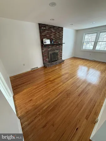 a view of an empty room with windows
