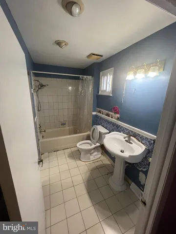 a bathroom with a sink toilet and vanity
