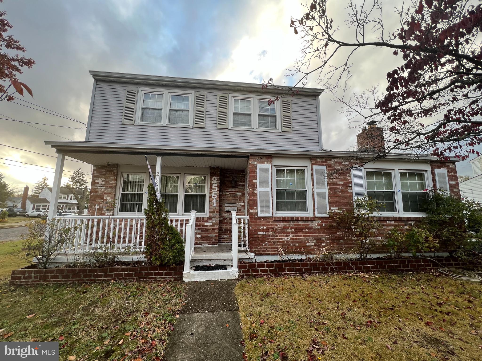 2561 Burning Tree Road Pennsauken, NJ 08109 - Photo 4 of 59 a front view of a house with a garden