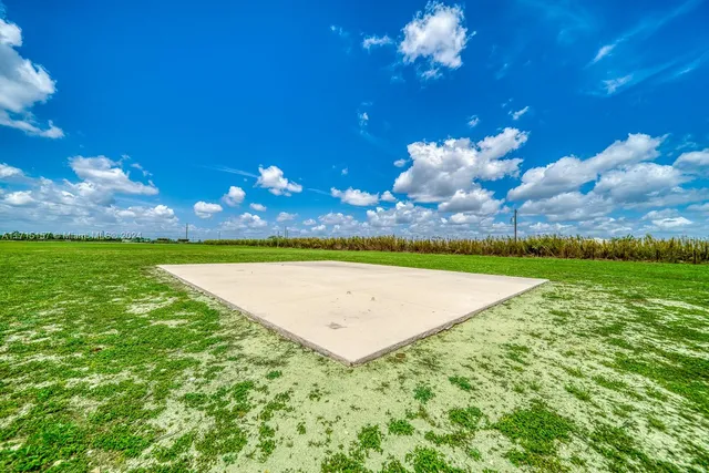 a view of a golf course with a swimming pool