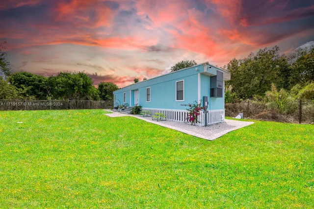 a view of a backyard with a garden and plants