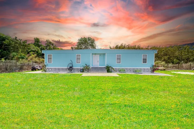 a front view of house with yard and seating area