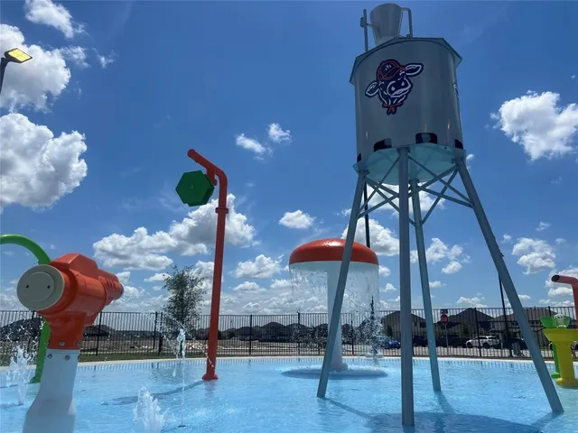 a room with lots of residential furniture and shower