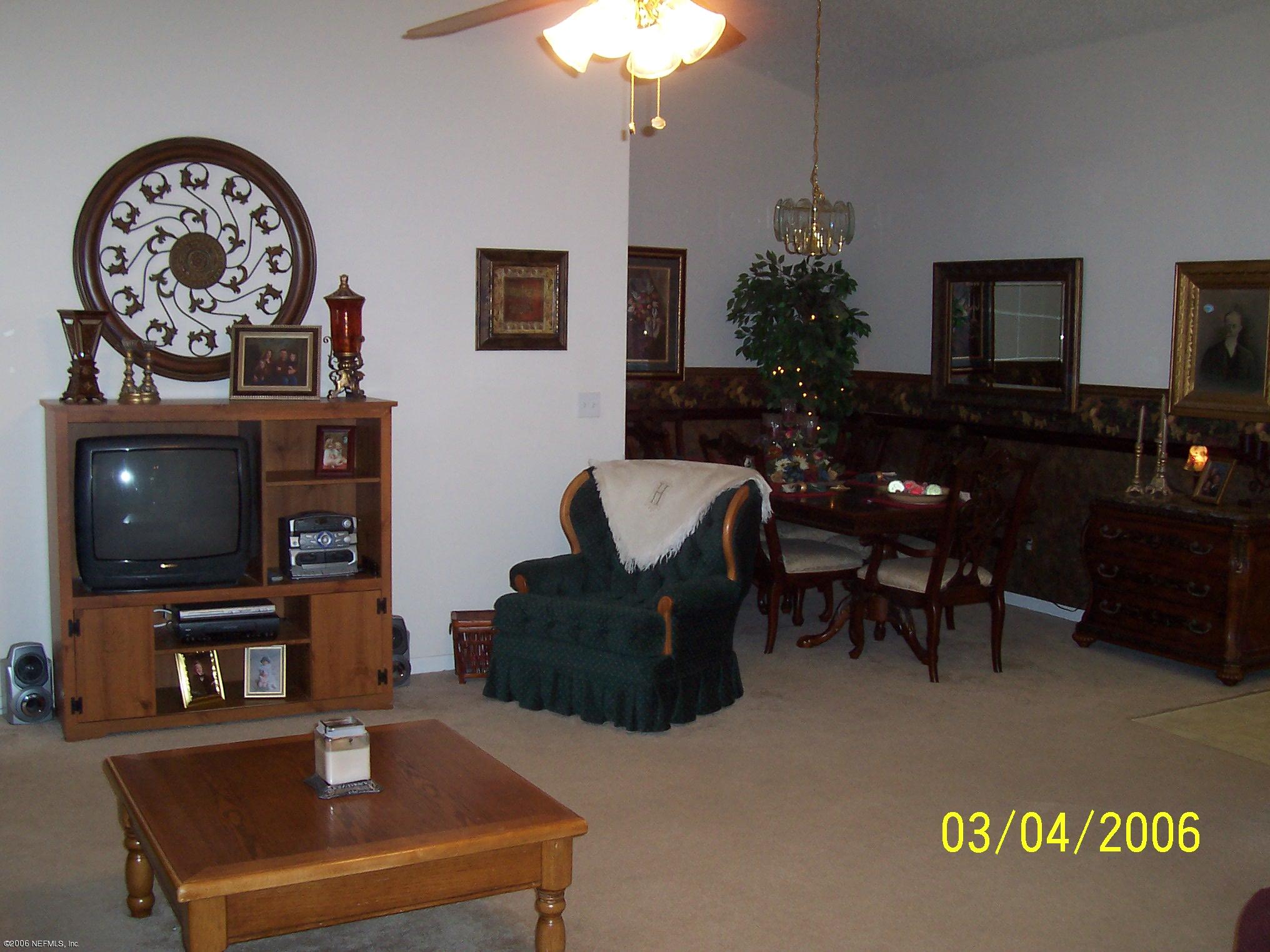 3709 Star Leaf Road Jacksonville, FL 32210 - Photo 8 of 11 Family Room Into Dining Room