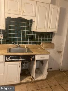 722 Shepherd Street Northwest Washington, DC 20011 - Photo 21 of 25 Renovation potential in a cozy kitchen space.
