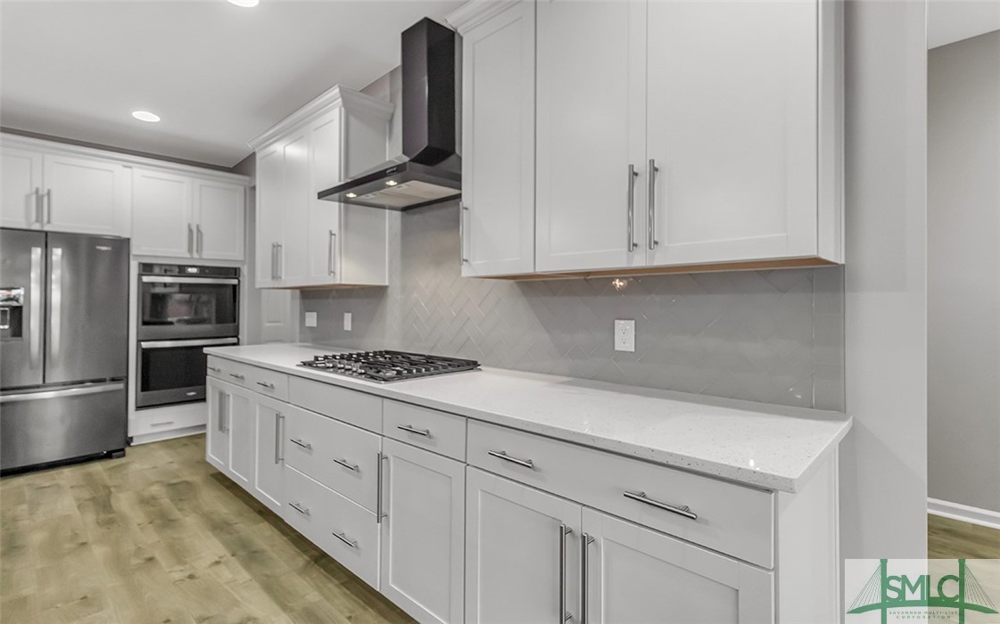 653 Wyndham Way Pooler, GA 31322 - Photo 11 of 48 Mosaic glass tile backsplash & separate cooktop