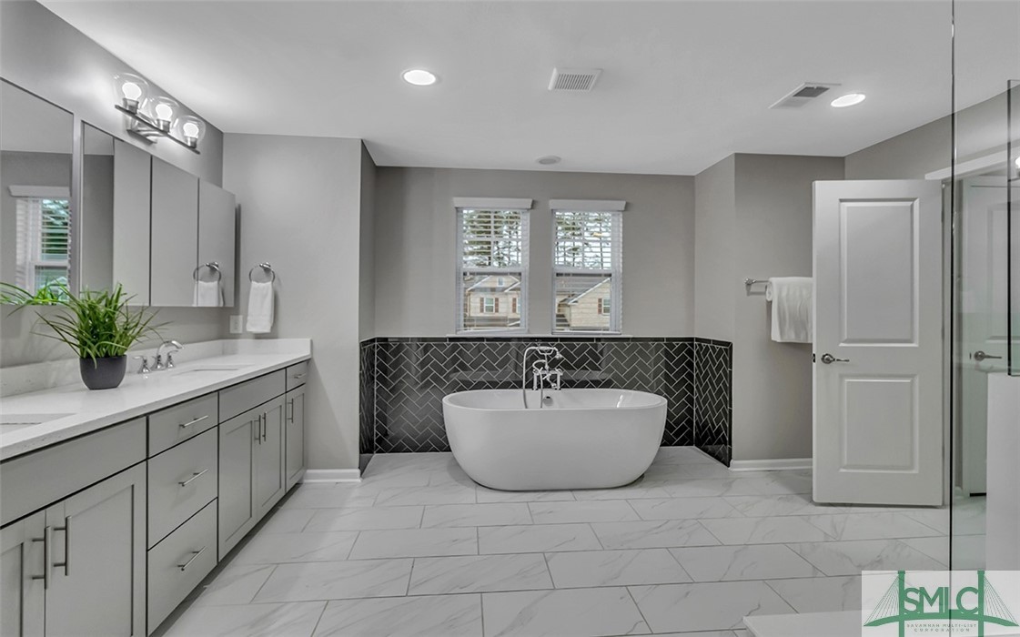 653 Wyndham Way Pooler, GA 31322 - Photo 3 of 48 Ensuite with ample cabinetry, tiled walk in shower