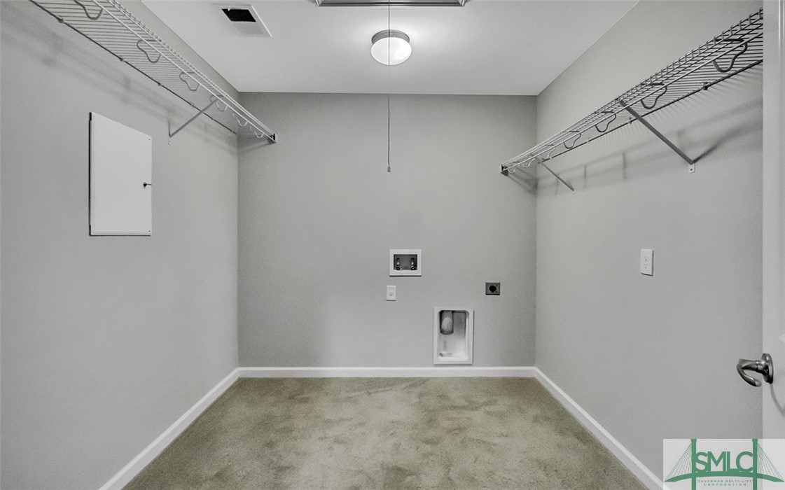 653 Wyndham Way Pooler, GA 31322 - Photo 32 of 48 The owners' suite has its own laundry hookups!