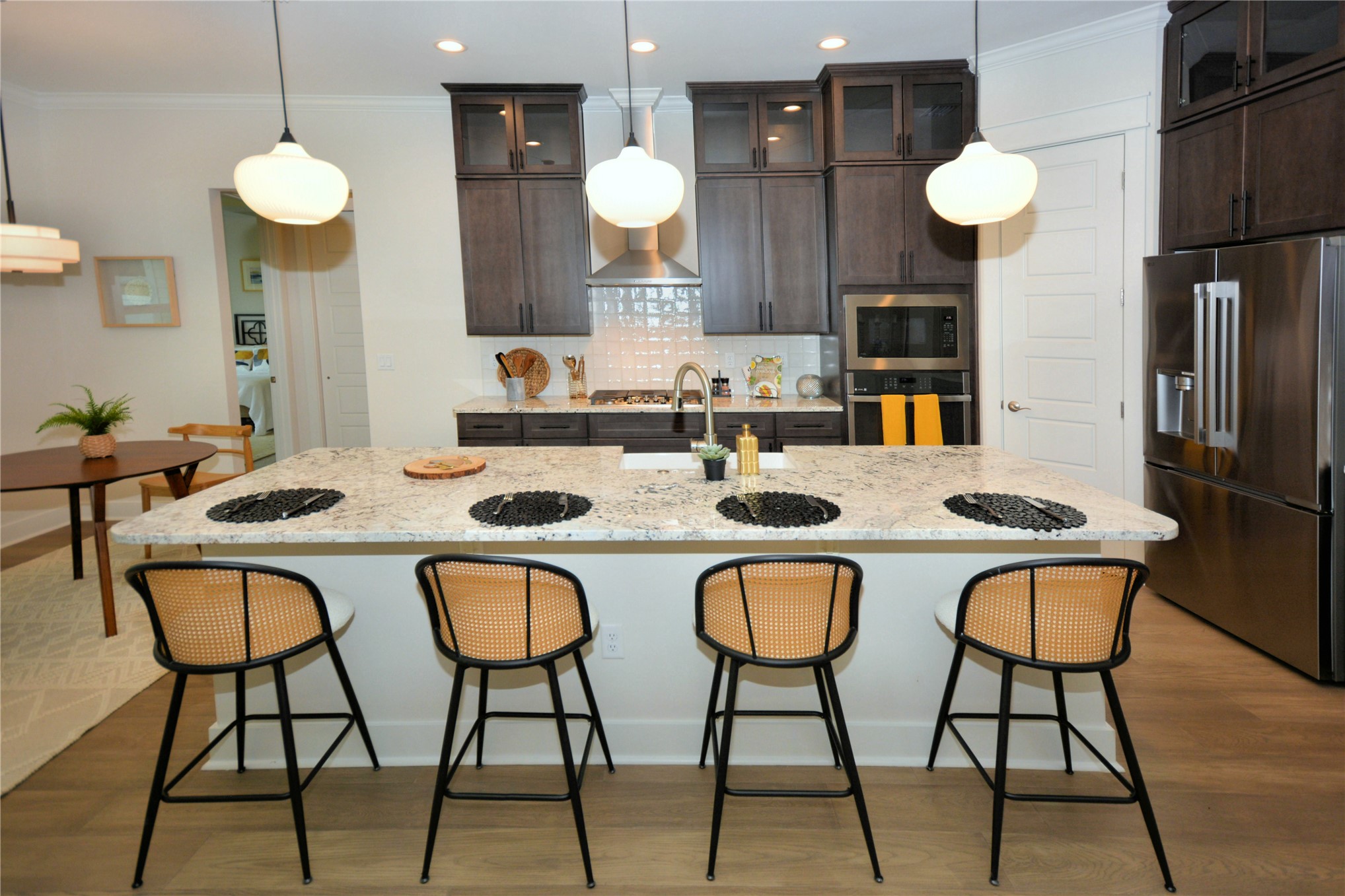 2646 Bailey Road Fernandina Beach, FL 32034 - Photo 13 of 42 a kitchen with stainless steel appliances granite countertop a table chairs stove and sink