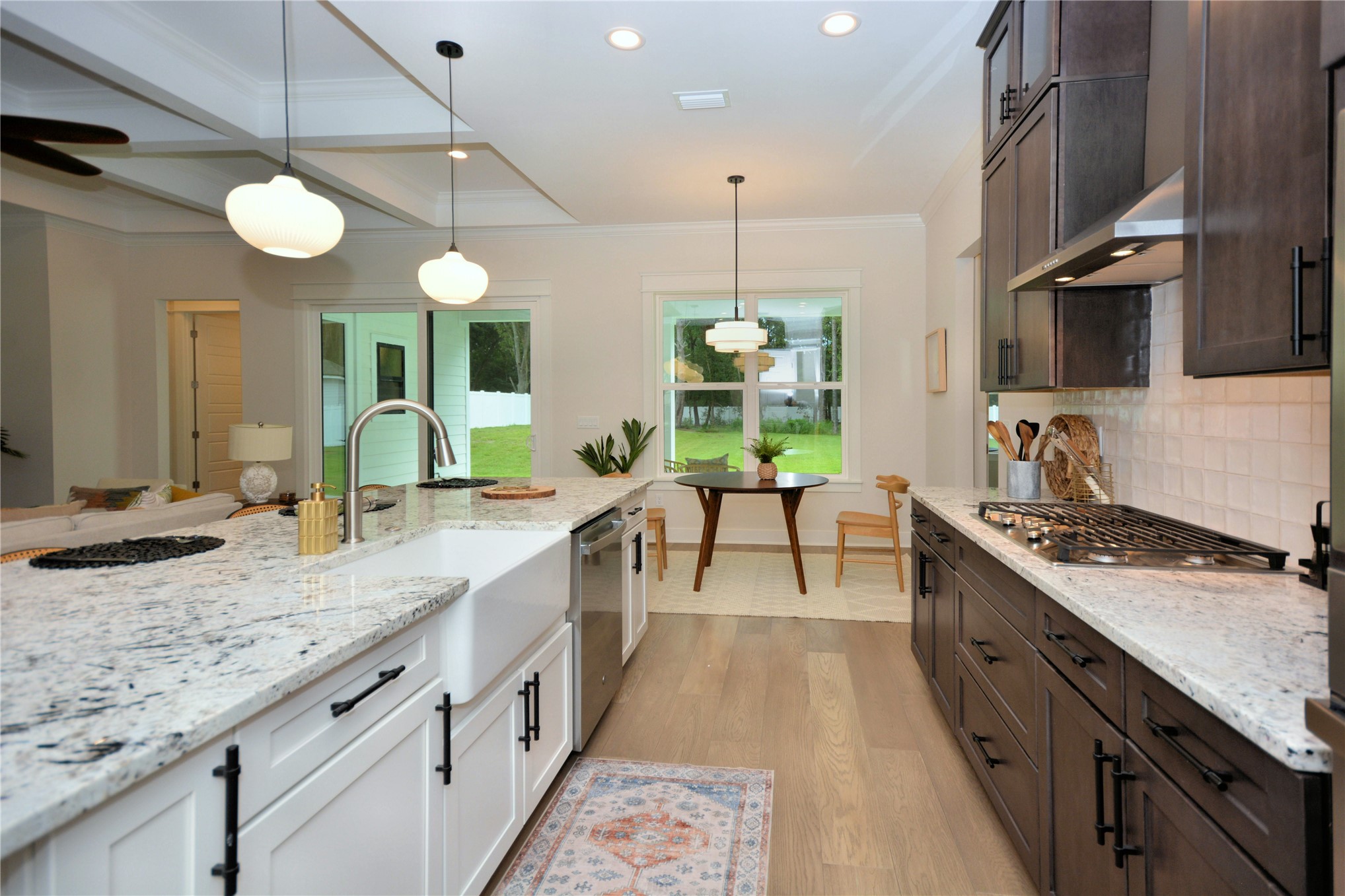 2646 Bailey Road Fernandina Beach, FL 32034 - Photo 14 of 42 a large kitchen with stainless steel appliances granite countertop a stove a sink and a wooden floors