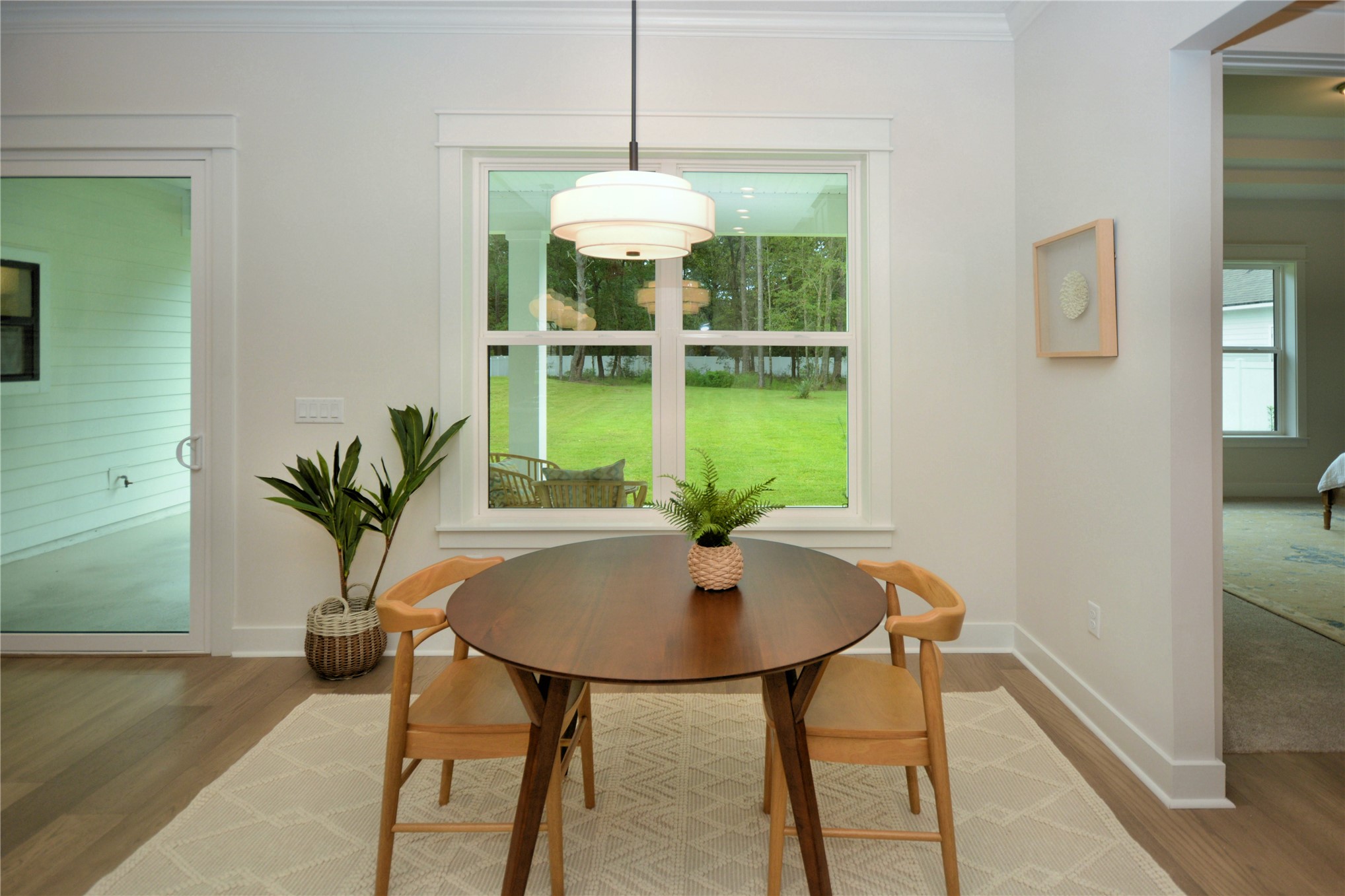2646 Bailey Road Fernandina Beach, FL 32034 - Photo 15 of 42 a dining room with furniture and a potted plant