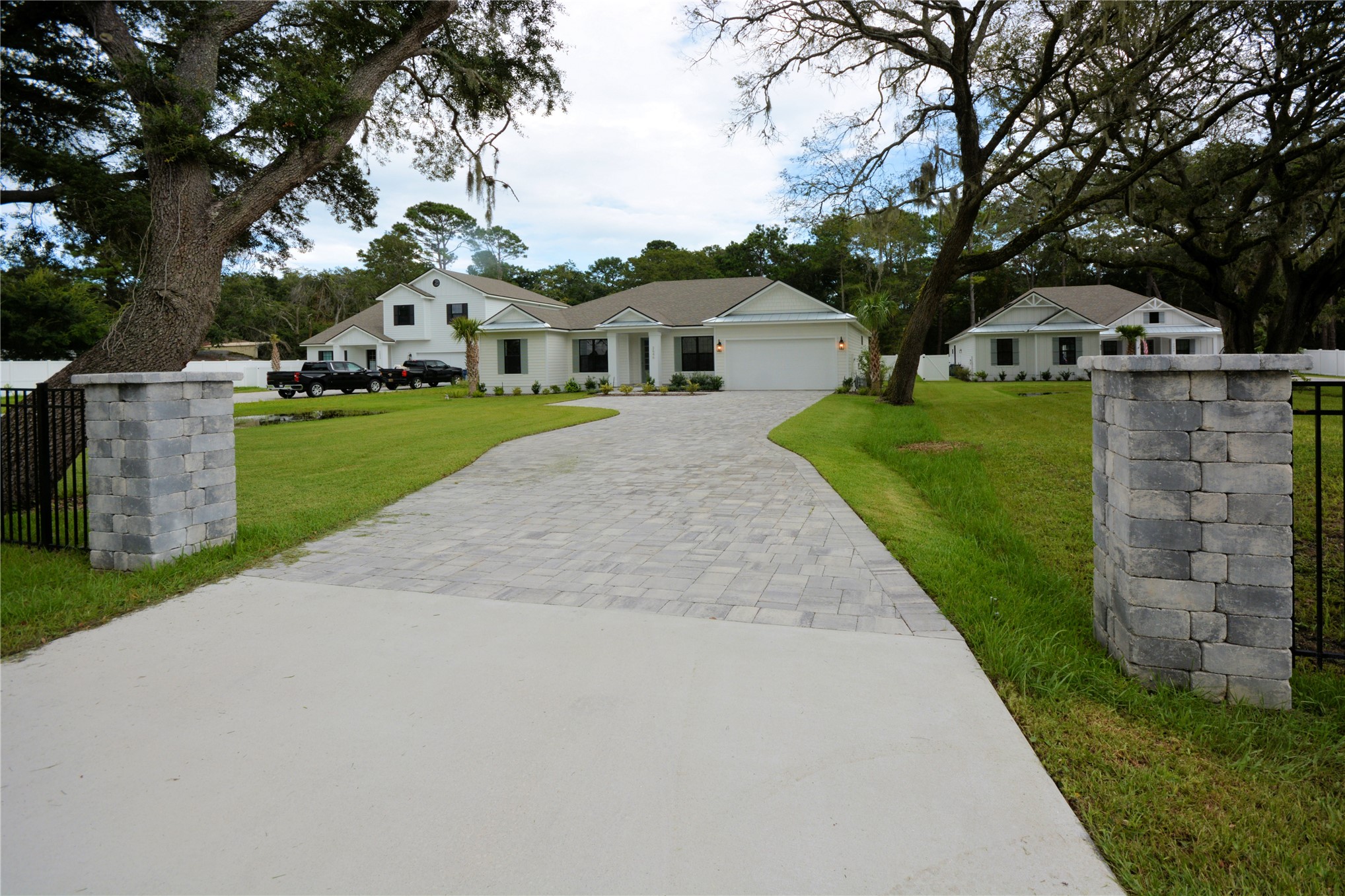 2646 Bailey Road Fernandina Beach, FL 32034 - Photo 2 of 42 a front view of a house with a yard