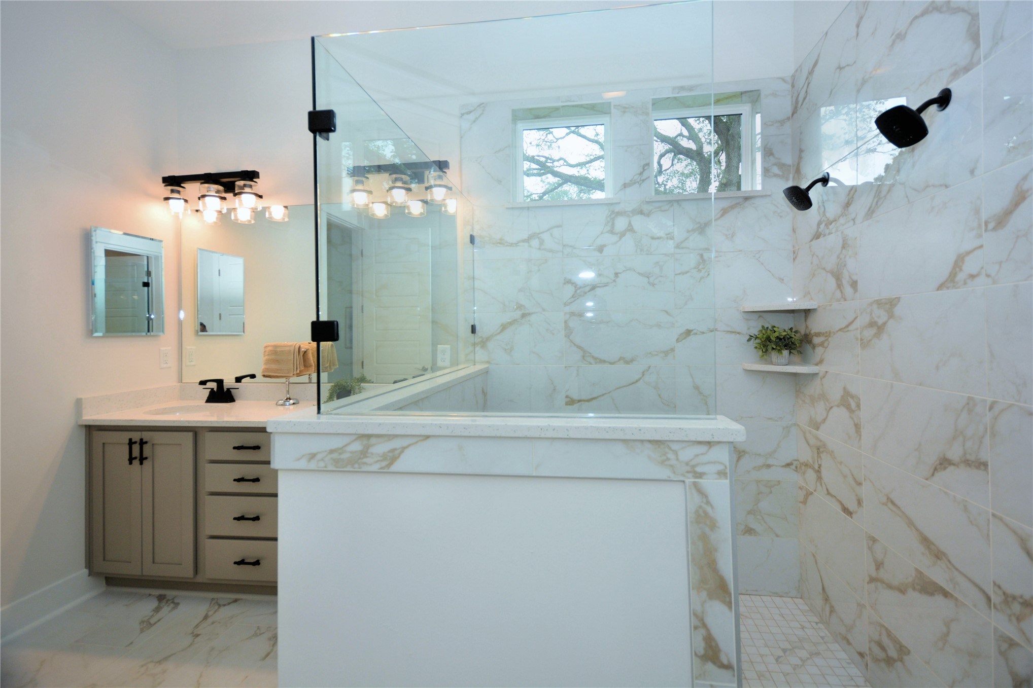 2646 Bailey Road Fernandina Beach, FL 32034 - Photo 29 of 42 a spacious bathroom with a granite countertop sink a mirror and shower