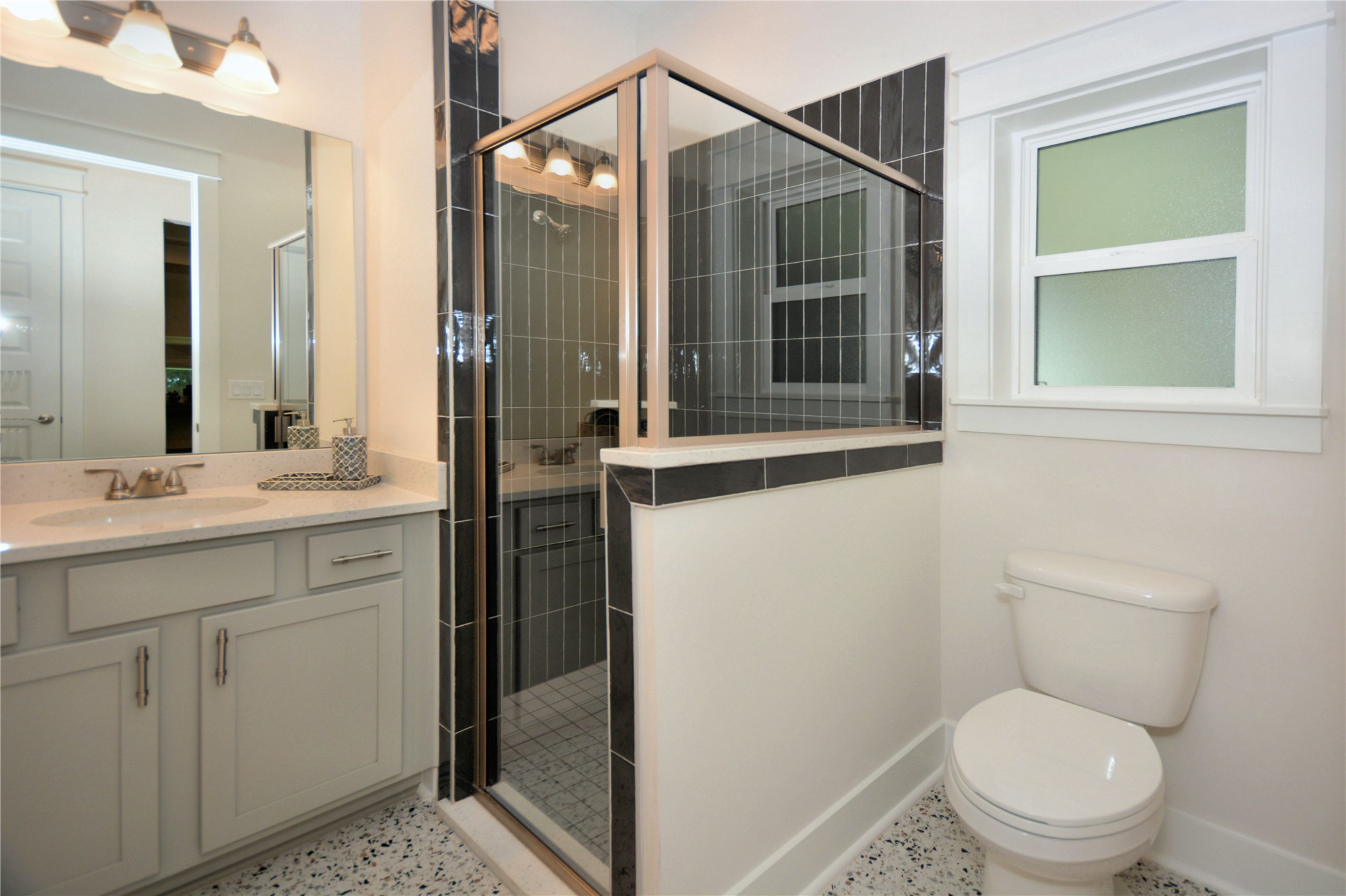 2646 Bailey Road Fernandina Beach, FL 32034 - Photo 34 of 42 a bathroom with a toilet shower vanity and a sink