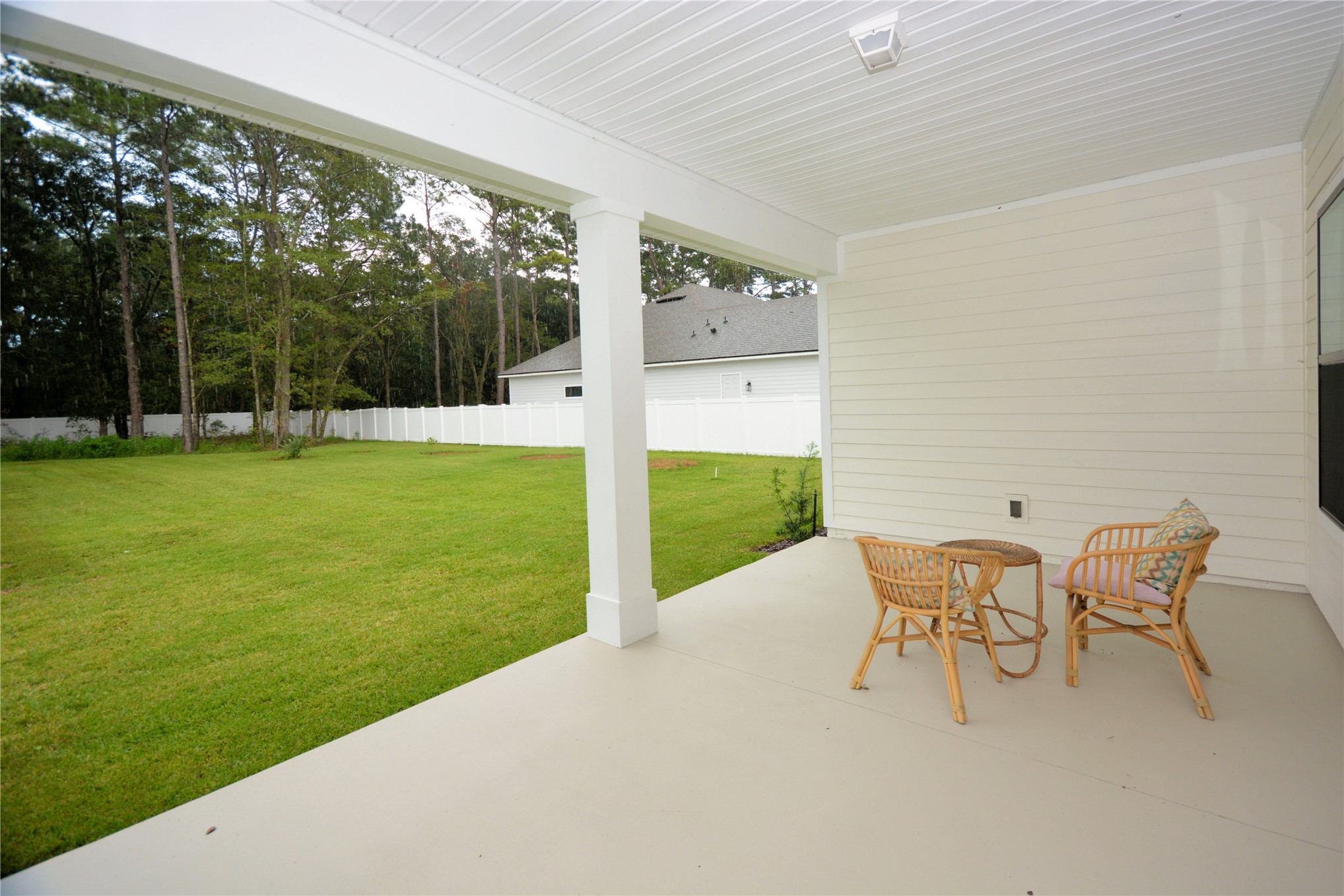 2646 Bailey Road Fernandina Beach, FL 32034 - Photo 35 of 42 a view of a chairs and table in patio with a yard