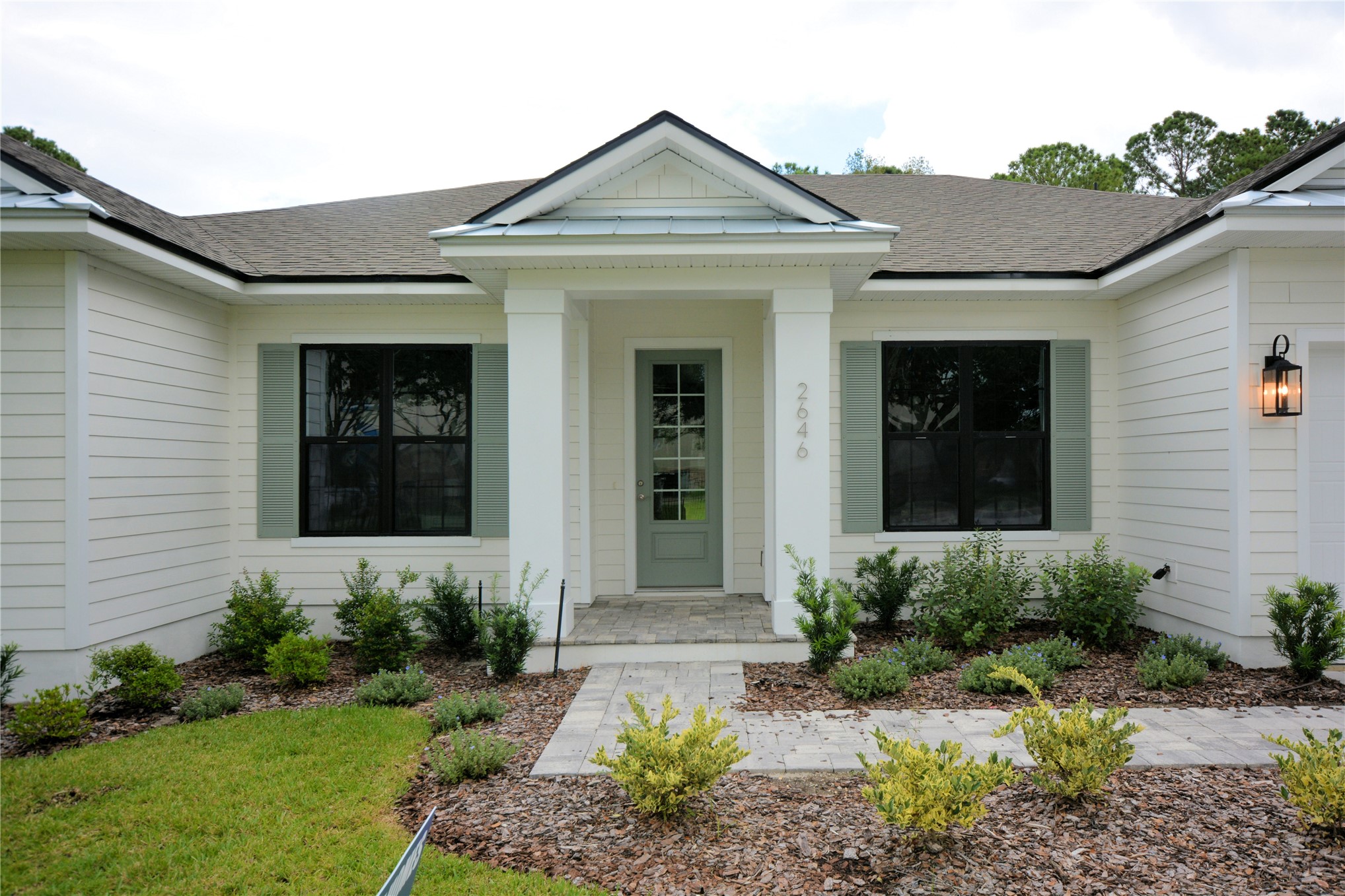 2646 Bailey Road Fernandina Beach, FL 32034 - Photo 4 of 42 a front view of a house with garden