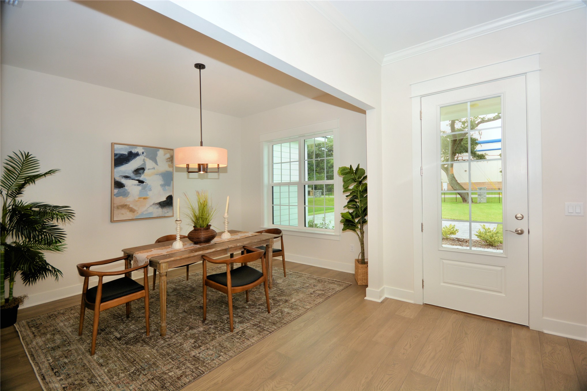 2646 Bailey Road Fernandina Beach, FL 32034 - Photo 5 of 42 a dining room with wooden floor and a chandelier