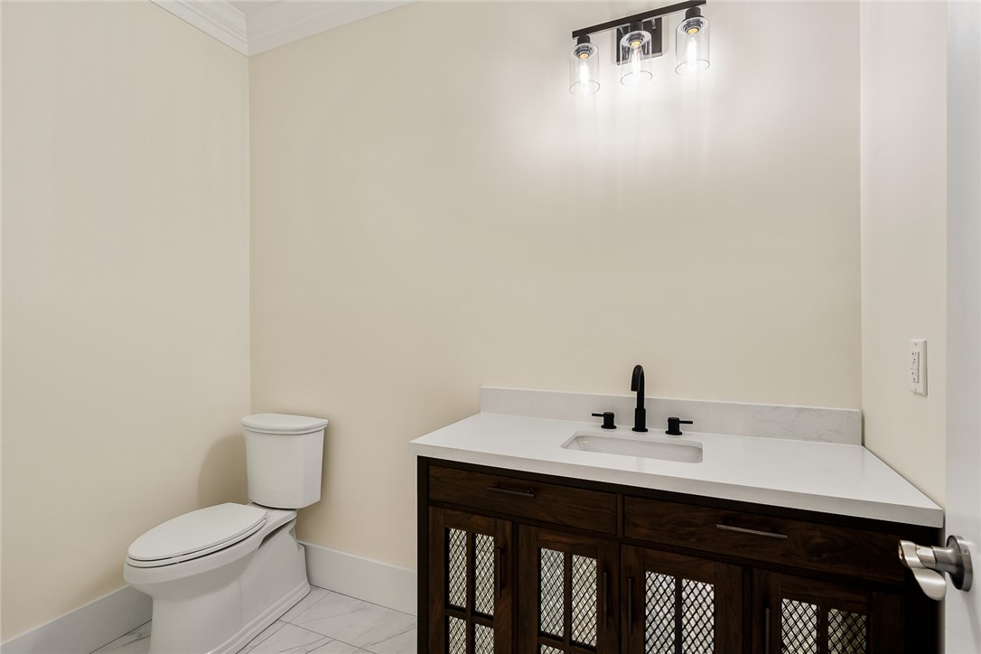 303 Regency Circle Anderson, SC 29625 - Photo 30 of 50 This clean and bright powder room features a classic vanity and contemporary fixtures.
