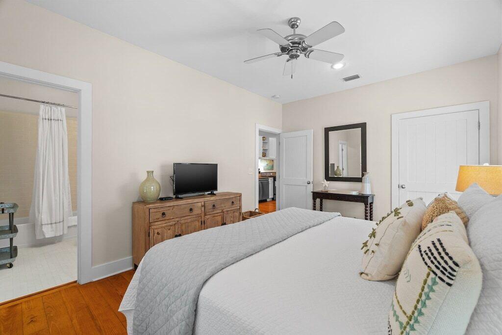 19 Olivia Lane Inlet Beach, FL 32461 - Photo 15 of 32 a bedroom with a bed and a chandelier