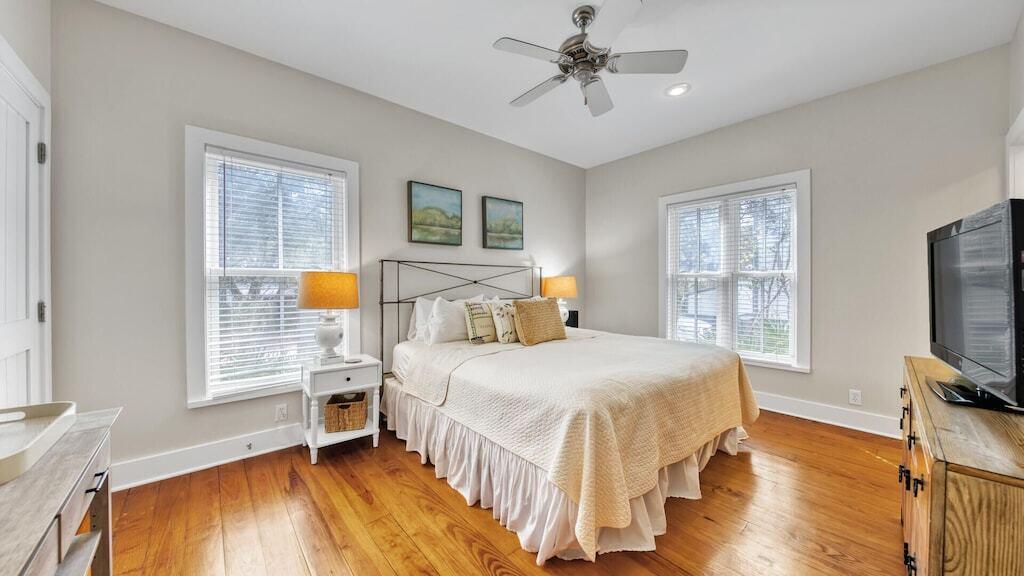 19 Olivia Lane Inlet Beach, FL 32461 - Photo 30 of 32 a bedroom with a bed a dresser and wooden floor