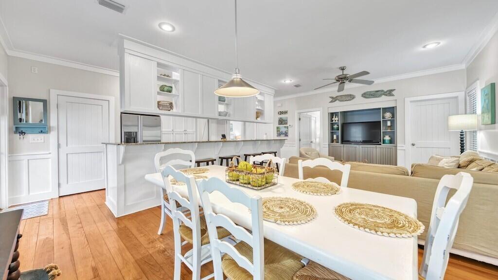 19 Olivia Lane Inlet Beach, FL 32461 - Photo 6 of 32 a view of a dining room with furniture and wooden floor