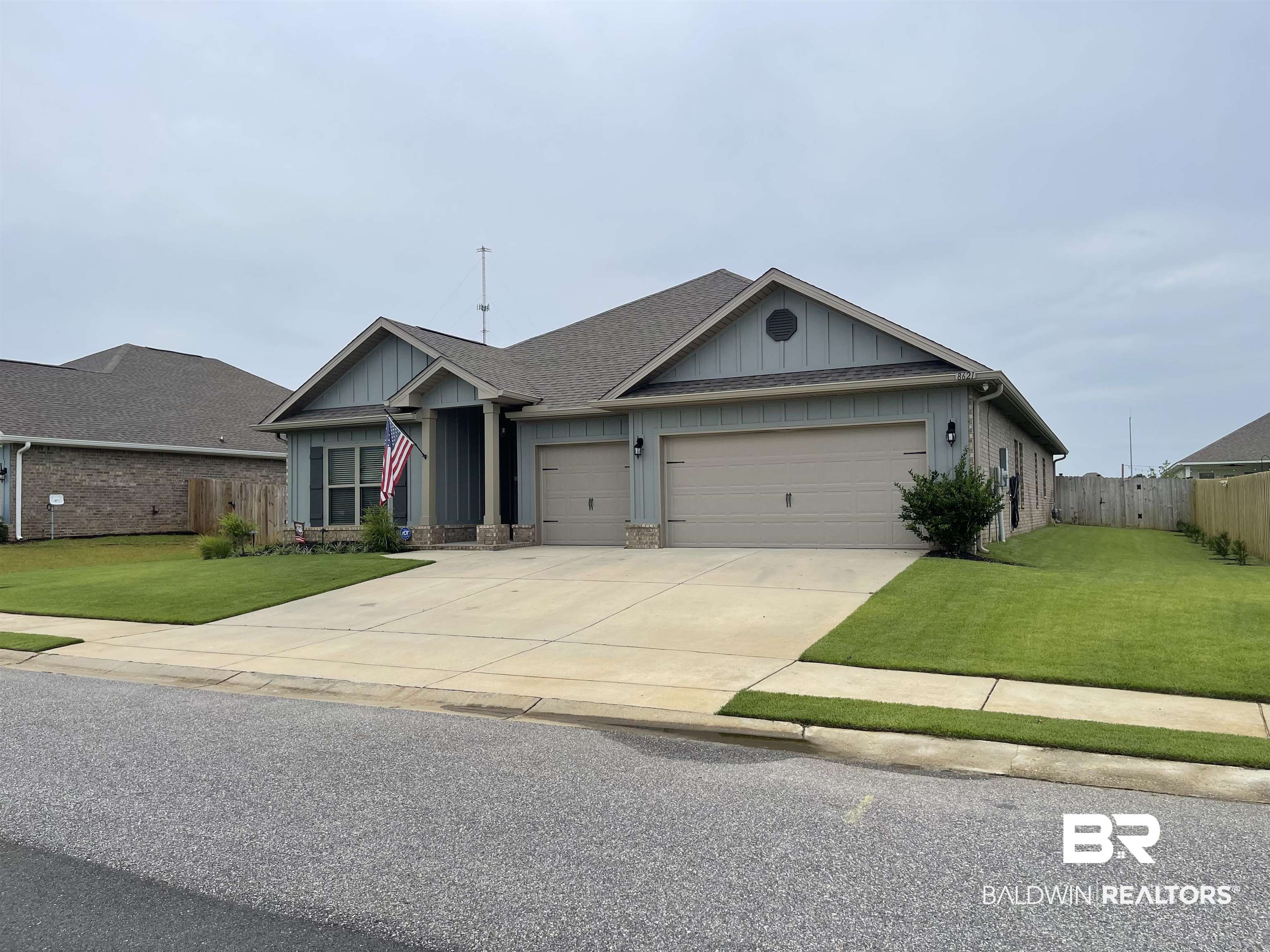 8621 Bronze Lane Foley, AL 36535 - Photo 3 of 13 View of front of home with a garage and a front lawn