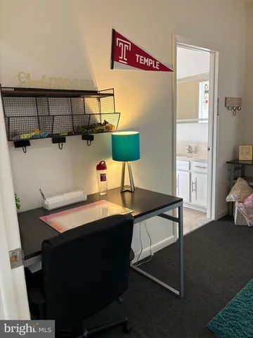 a room with table chairs and wooden floor