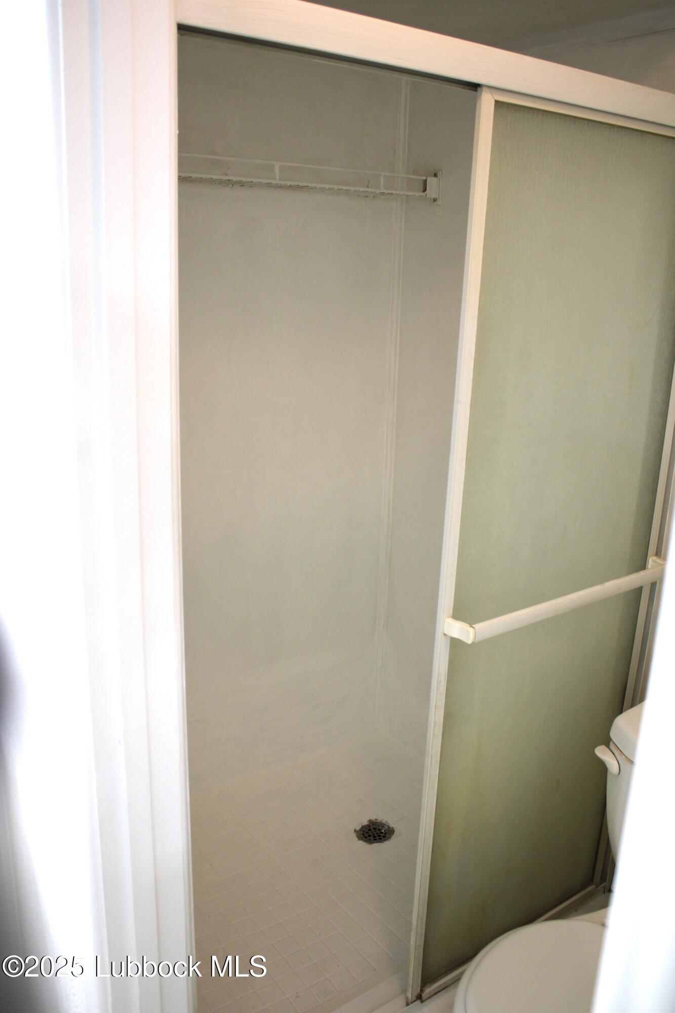 5503 36th Street Lubbock, TX 79407 - Photo 15 of 22 a bathroom with a sink and a toilet