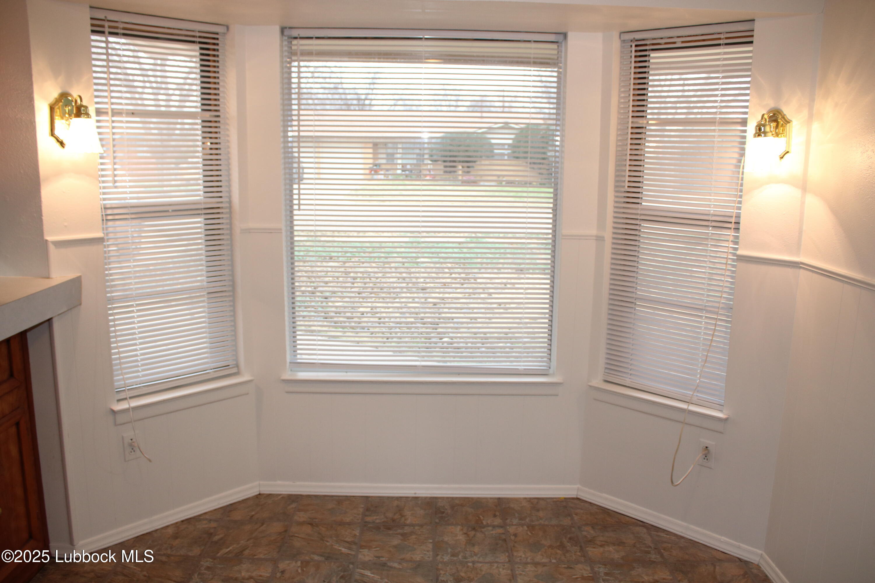 5503 36th Street Lubbock, TX 79407 - Photo 4 of 22 a view of a room that has a window in it