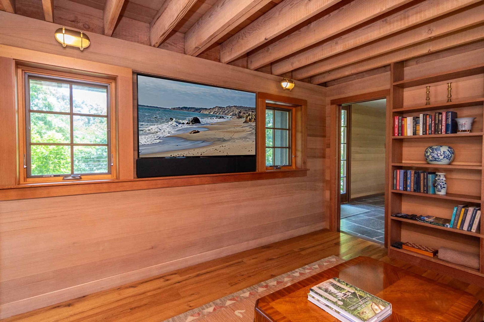 15 Old Farm Road Chilmark, MA 02535 - Photo 16 of 51 a living room with furniture and a book shelf