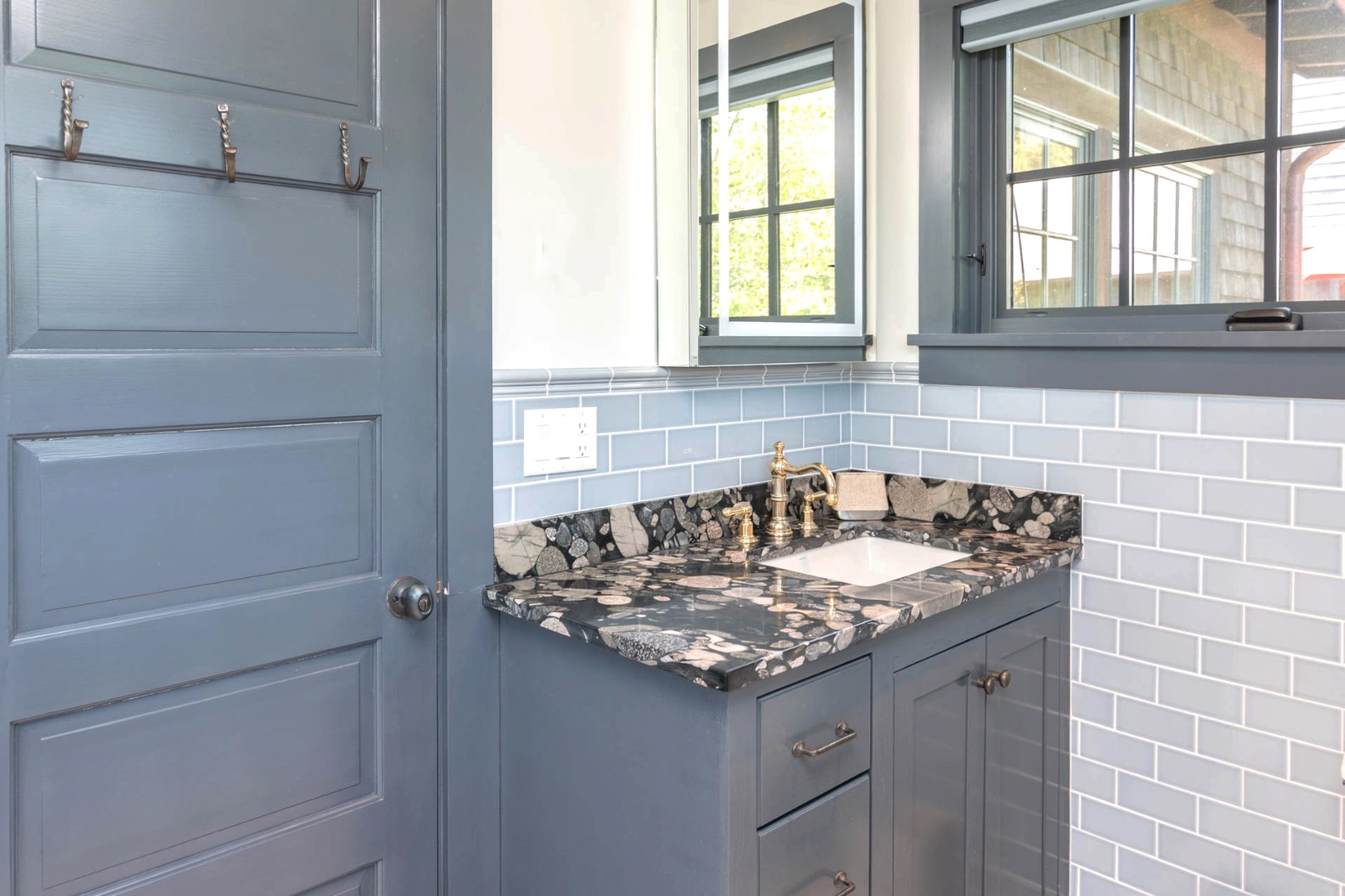 15 Old Farm Road Chilmark, MA 02535 - Photo 32 of 51 a bathroom with a granite countertop sink and a window