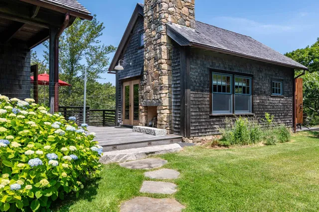 a view of a wooden deck and a patio
