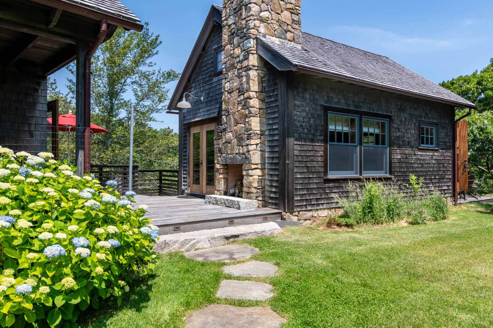 15 Old Farm Road Chilmark, MA 02535 - Photo 43 of 51 a view of brick house with a yard and plants