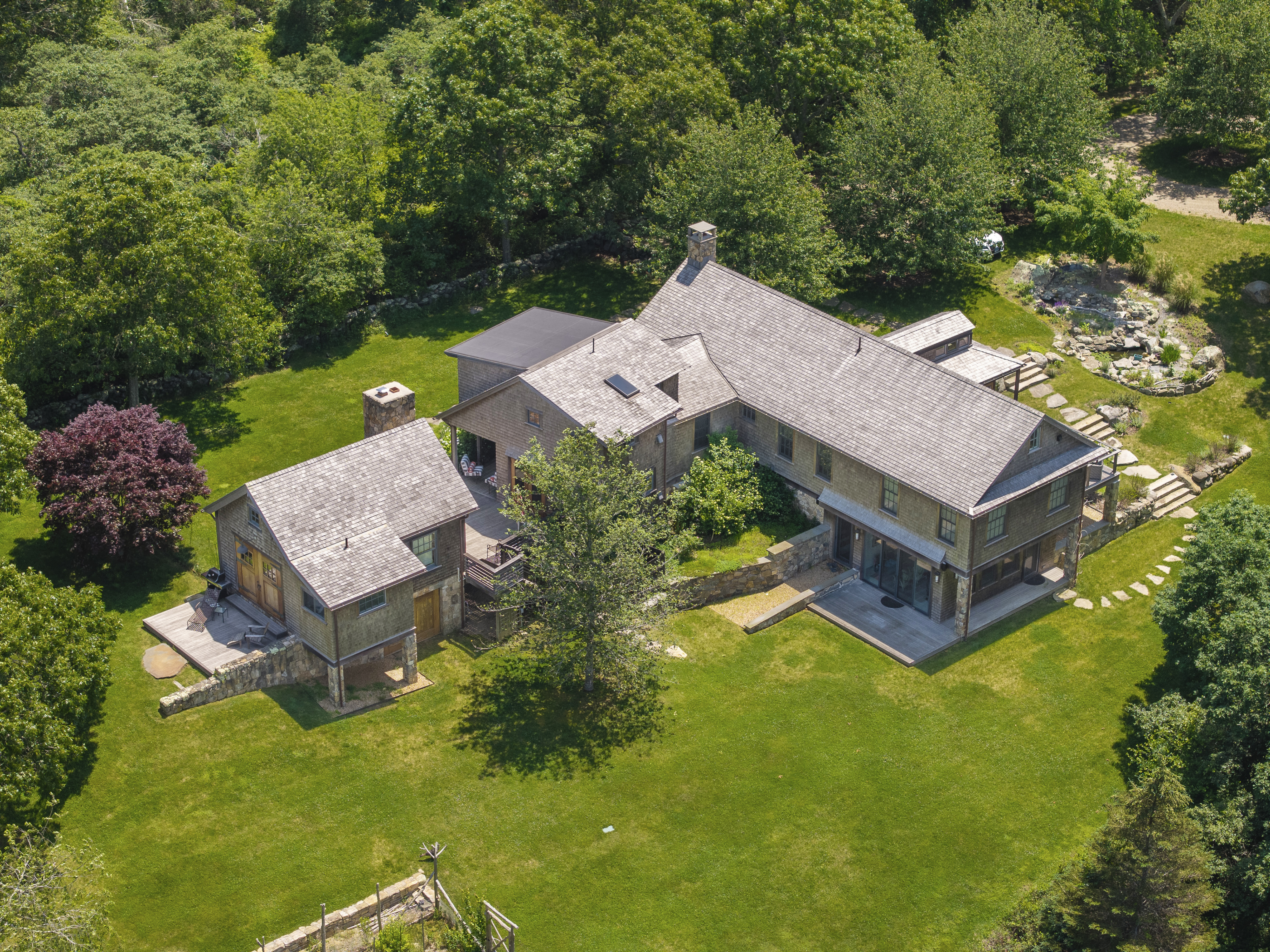 15 Old Farm Road Chilmark, MA 02535 - Photo 5 of 51 an aerial view of a house with a garden and trees