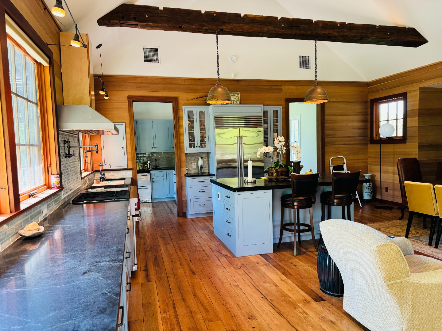 15 Old Farm Road Chilmark, MA 02535 - Photo 9 of 51 a dining hall view with a large dining table and chairs with wooden floor