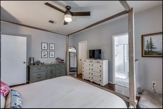 a room with a bed and furniture