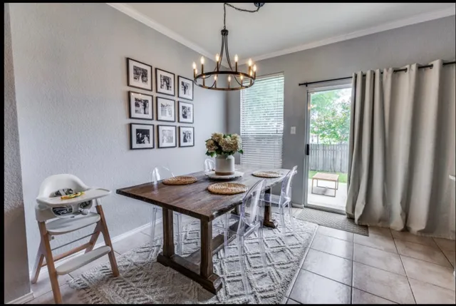 a view of a dining room with furniture and window