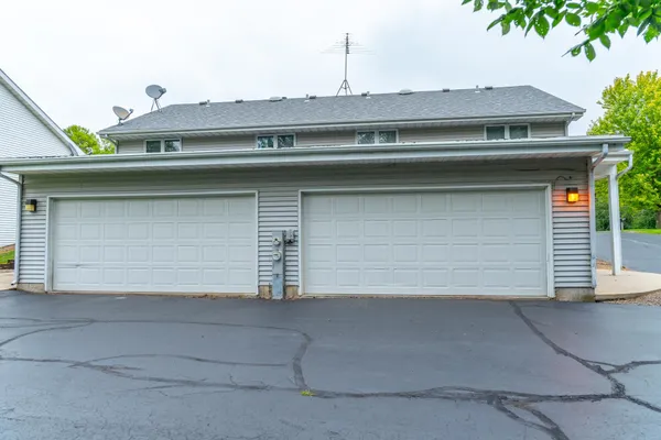 a view of a house with a small yard and plants