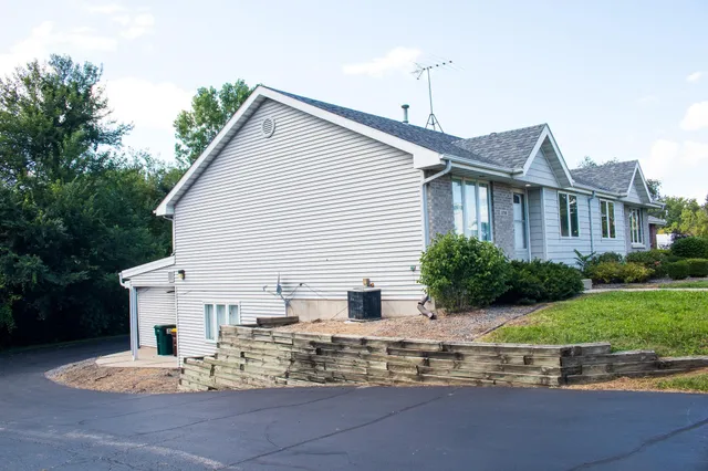aerial view of a house with a tree