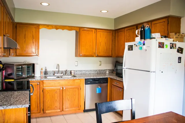 a bed room with two beds and a window