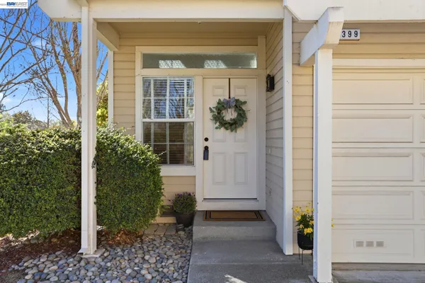 a view of entryway with wooden floor and door