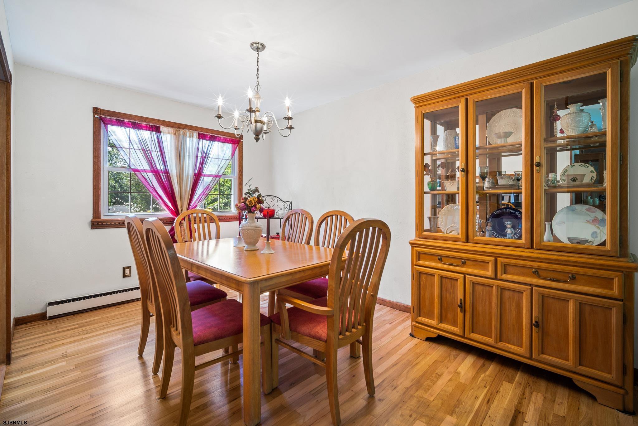 1326 Elwood Road Hammonton, NJ 08037 - Photo 18 of 36 a view of a dining room with furniture window and wooden floor
