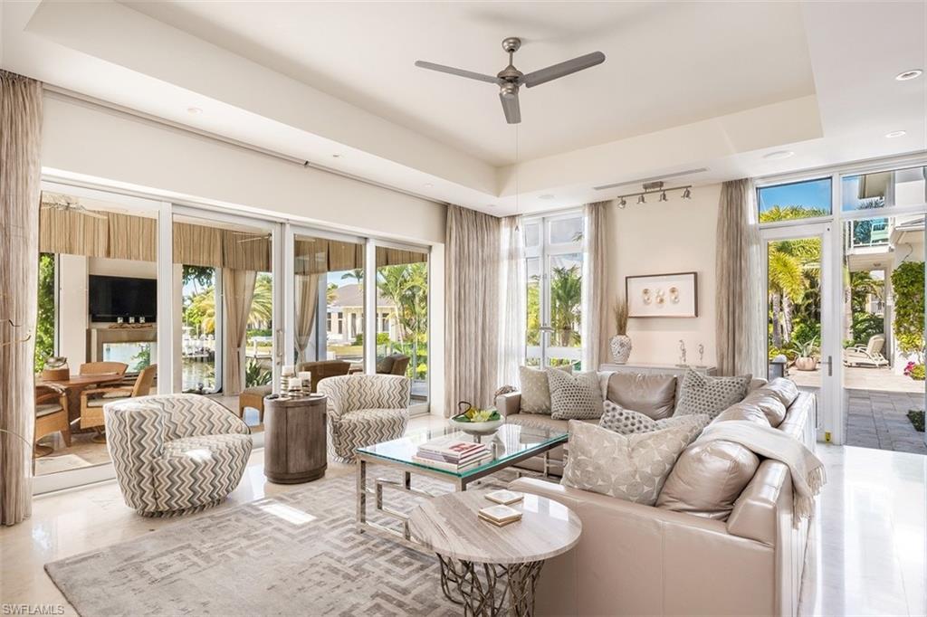 2290 Tarpon Road Naples, FL 34102 - Photo 11 of 35 a living room with furniture and a large window
