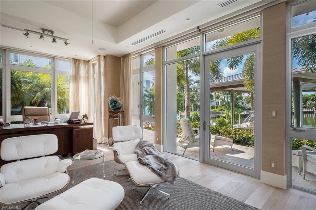 2290 Tarpon Road Naples, FL 34102 - Photo 14 of 35 a living room with furniture and a window