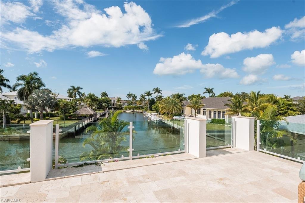 2290 Tarpon Road Naples, FL 34102 - Photo 18 of 35 a view of a lake from a yard
